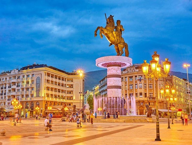 A lively evening at Macedonia Square in Skopje, featuring the Warrior on a Horse statue and glowing streetlights..jpg