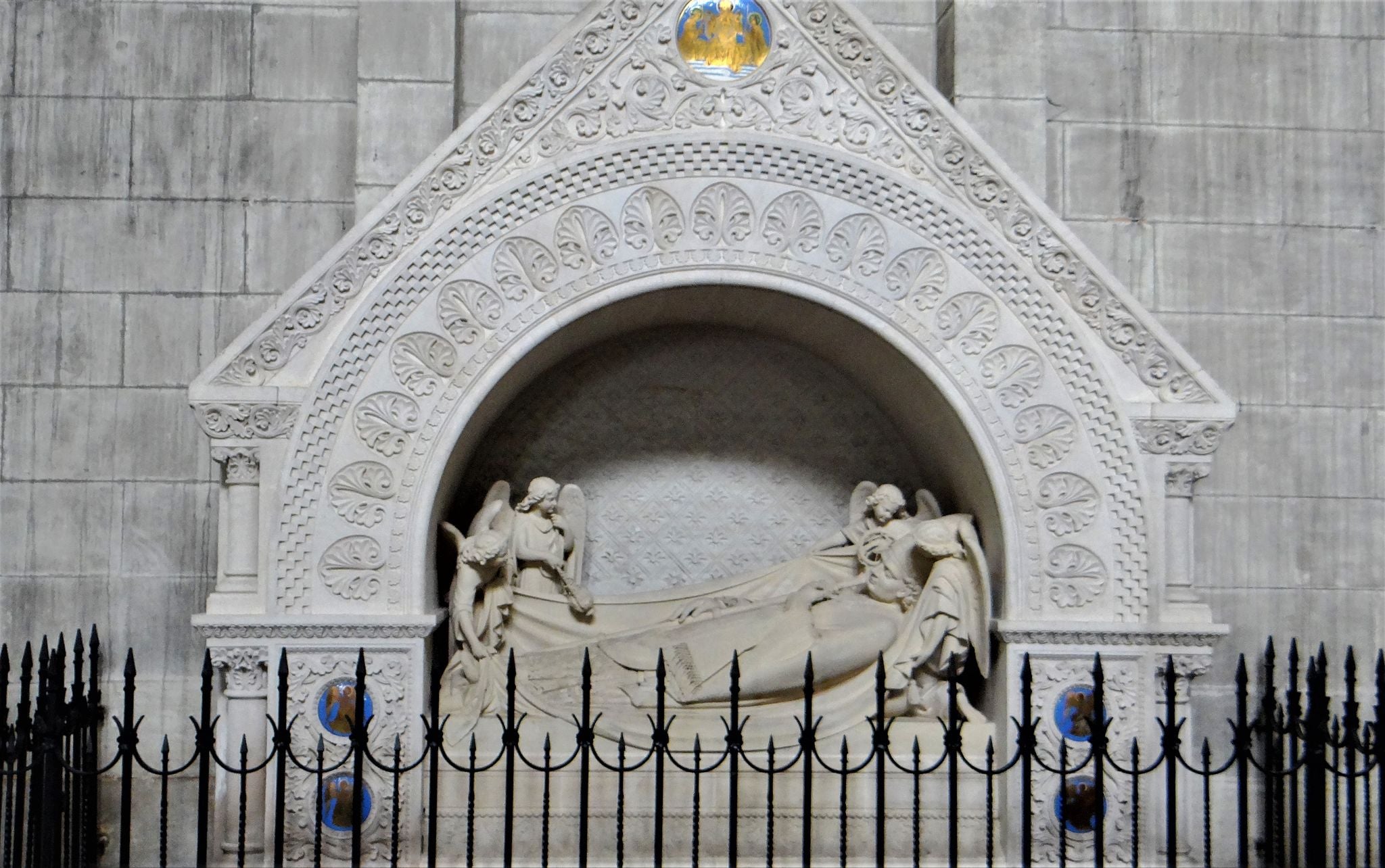 Tomb of Jean-Baptiste-Amédée George de La Massonnais . The bishop's recumbent figure was sculpted in 1863 by Michel-Pascal .