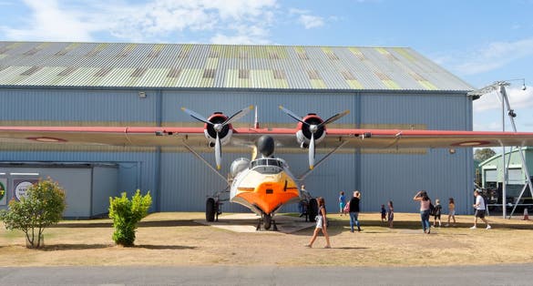 Royal Air Force Museum ,UK 2018. Visitors are watching the plane Consolidated - PBY-6A Catalina.