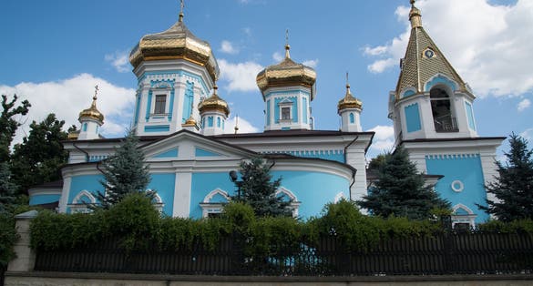 Photo of Chisinau Ciuflea Monastery Saint Theodore Tyro, Main Church Side View with Golden Cupola Crosses, Moldova.