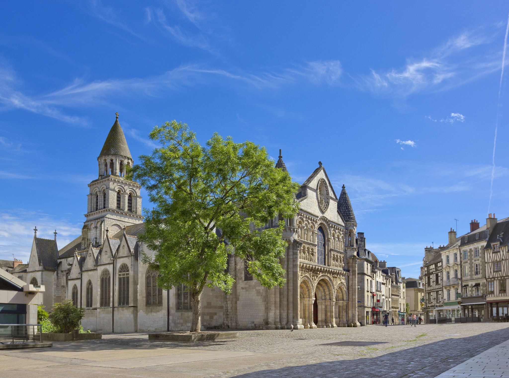 Photo of cityscape with medieval church of Notre-Dame la Grande in Poitiers, France.