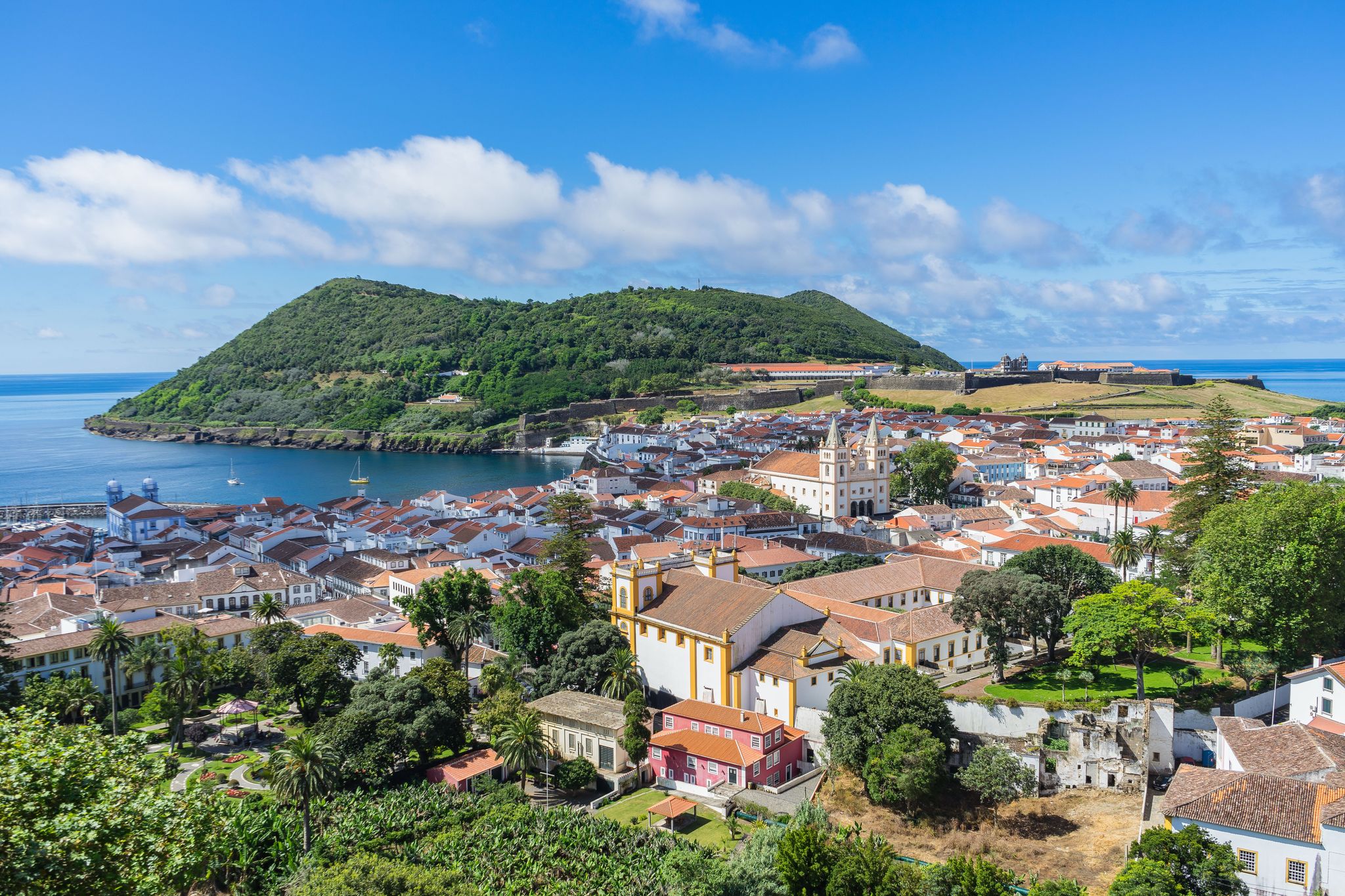 Photo of sunny view of Angra do Heroismo from Alto da Memoria, Terceira, Azores, Portugal.