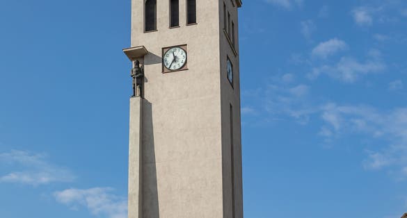 Kaunas, Lithuania - October 2, 2021: Tower with the carillion and the clock besides Vytautas the Great War Museum in Vienybes square.