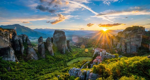 Photo of Sunset over monastery of Rousanou and Monastery of St. Nicholas Anapavsa in famous greek tourist destination Meteora in Greece.
