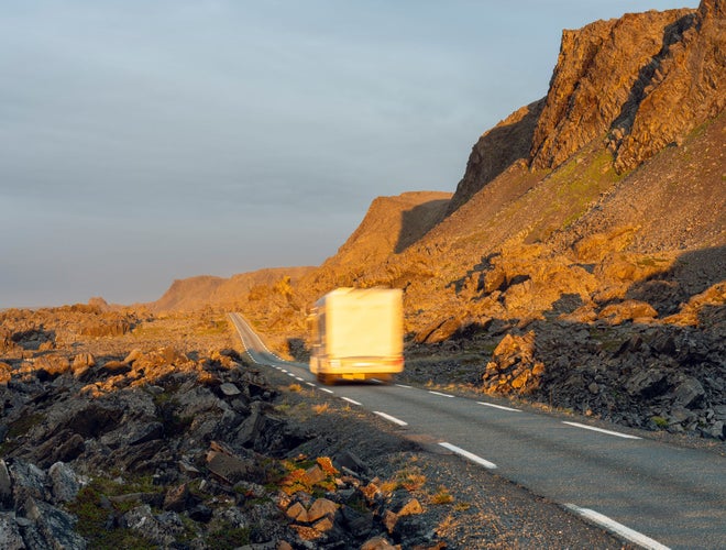 A camper van traveling along the Norwegian Scenic Route Varanger near Båtsfjord, Norway..jpg