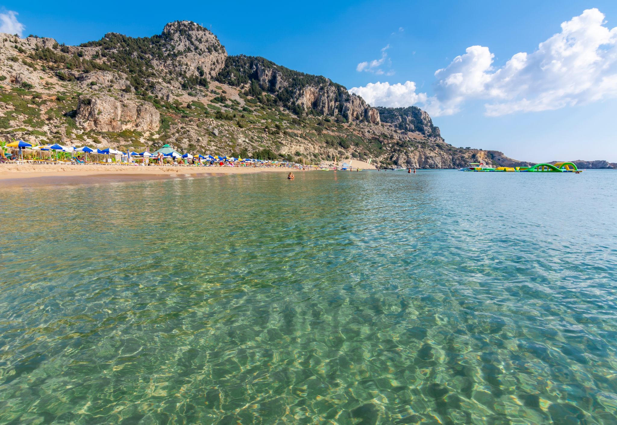 photo of view of Tsampika sandy beach on rhodes island, Greece.