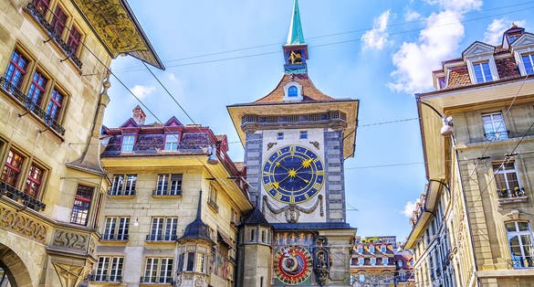 photo of astronomical clock on the medieval Zytglogge clock tower in Kramgasse street in old city center of Bern, Switzerland.