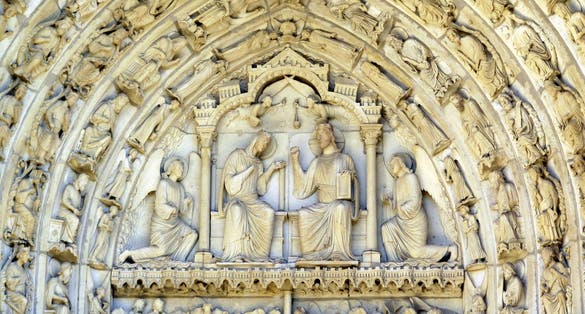 The tympanum over the center portal of the north transept. On the lintel are the Dormition (Death) and Assumption of the Virgin. Above is the Coronation of the Virgin: Mary, in her living body, will rule the heavens alongside her Son Christ.