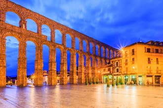 photo of view of Tourism at Segovia, Roman aqueduct on plaza del Azoguejo in Spain.