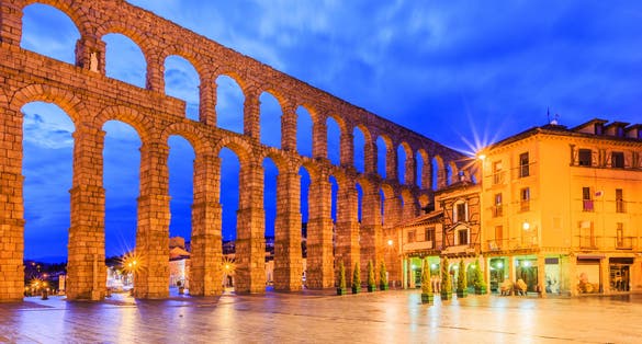 photo of view of Tourism at Segovia, Roman aqueduct on plaza del Azoguejo in Spain.