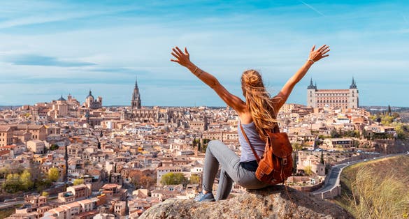 photo of view of Woman tourist enjoying panoramic view of Toledo city- Castilla la Mancha, Spain