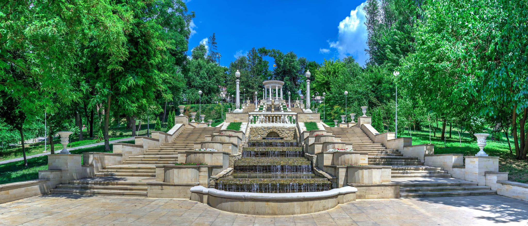 photo of Chisinau, Moldova – 06.28.2019. Fountains and the cascading stairs near the valea morilor lake in Chisinau, Moldova, on a sunny summer day.