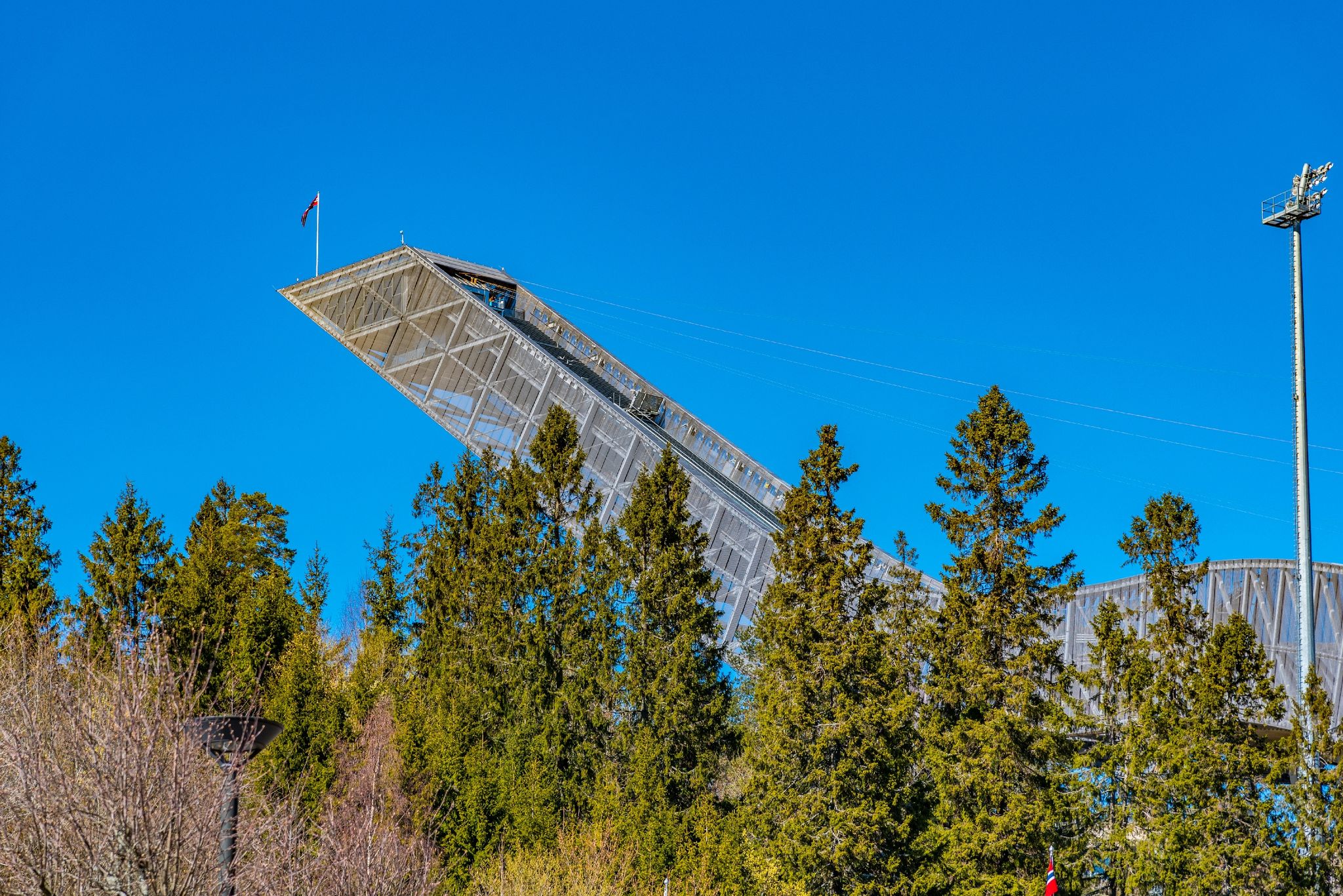 Photo of Holmenkollen ski jumping stadium and norwegian ski museum in Oslo, Norway.