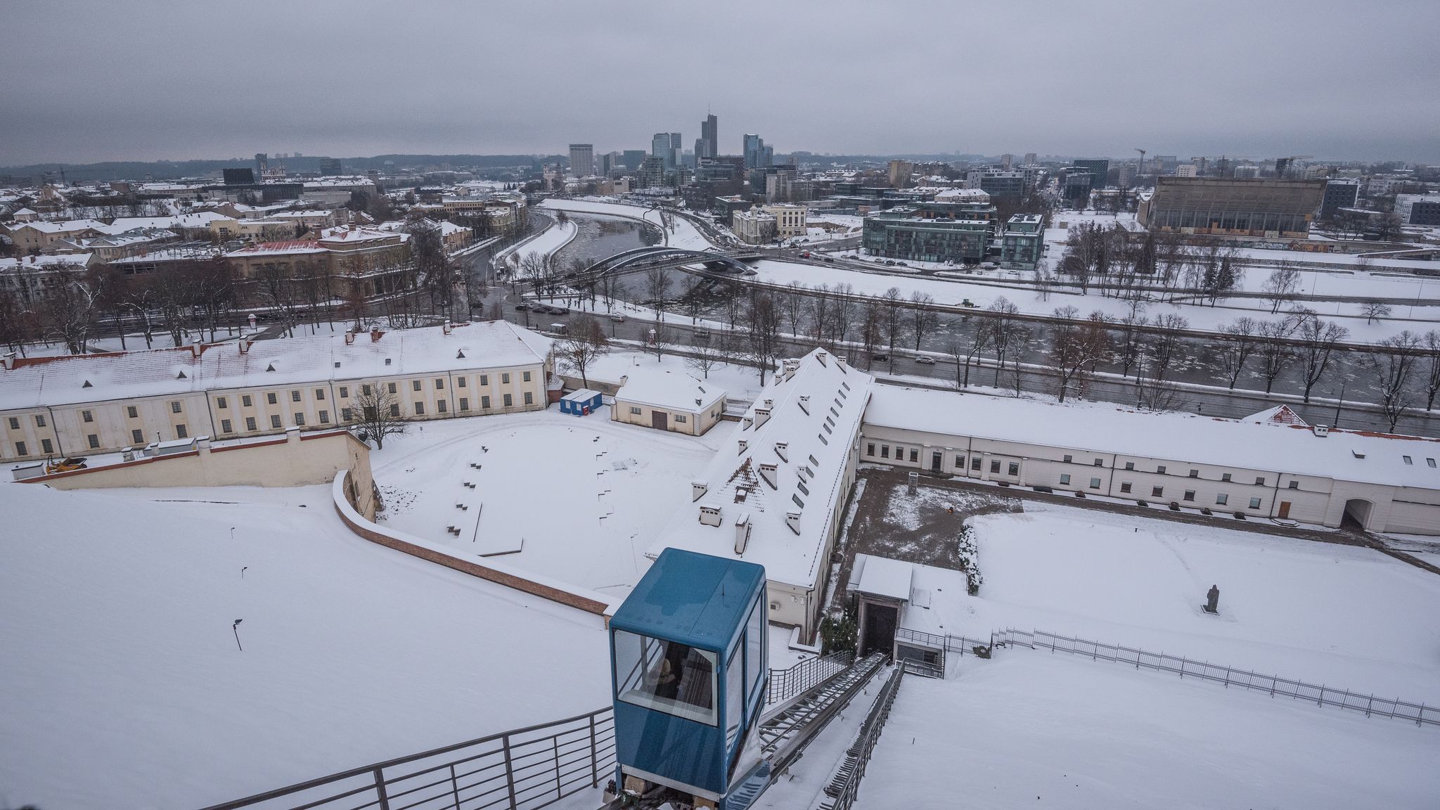 Winter view of the Lithuanian National Museum and the Museum of Applied Art with Neris river and Vilnius downtown in the background, as seen from Gediminas Tower hill, Vilnius, Lithuania