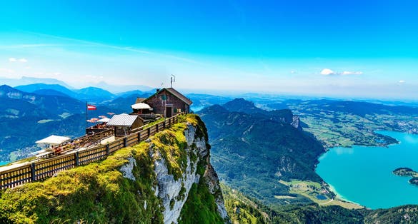 Photo of amazing view from Schafberg by St. Sankt Wolfgang im in Salzkammergut, Blue sky, alps mountains, Salzburg, Austria.