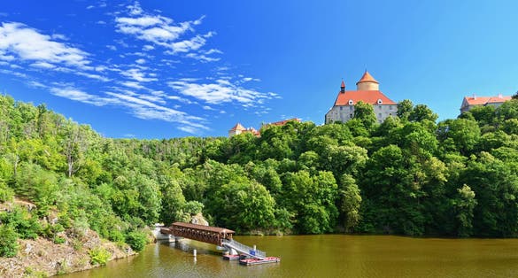 Photo of beautiful old castle Veveri. Landscape with water on the Brno dam during summer holidays, Czech Republic.
