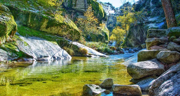 photo of  view of The Eresma River as it passes through the area of La Boca del Asno, in the Royal Site of San Ildefonso, Segovia (Spain).