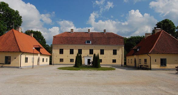 photo of the front courtyard of the crown estate manor in Roma Abbey, Gotland, Sweden.