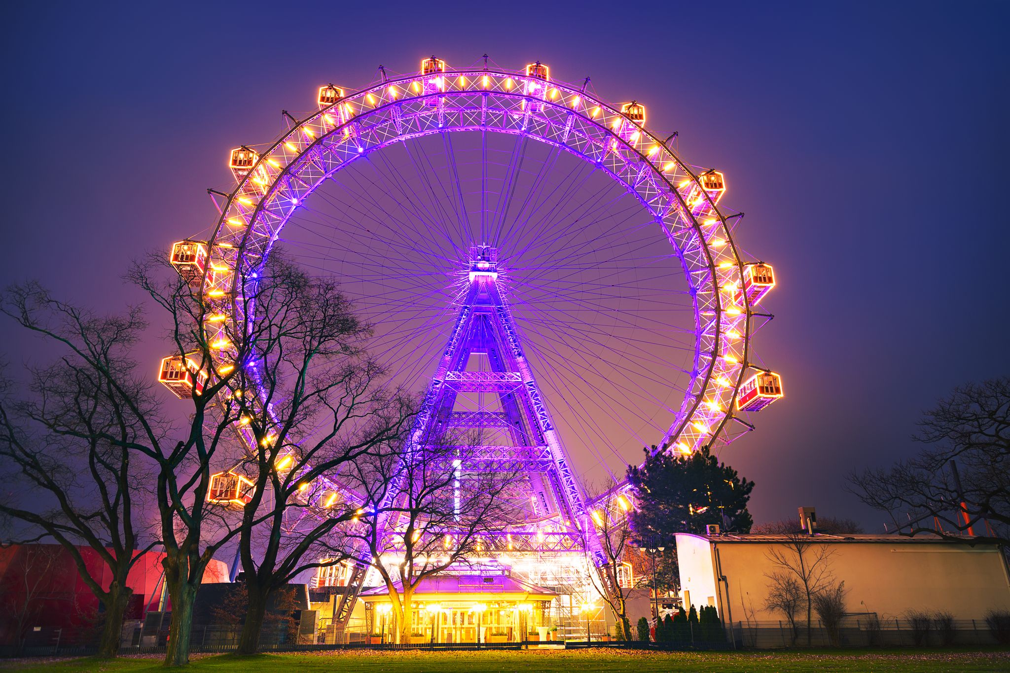 Photo of lighting Ferris wheel in the night, Vienna Prater, Wiener Riesenrad an amusement park in Austria