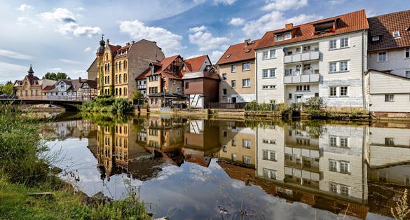 Photo of Reflection of houses in the Werra river in Eschwege Germany.