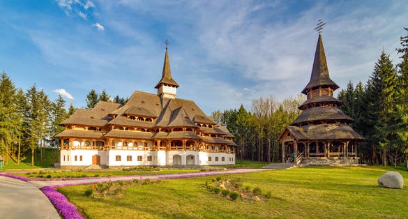Photo of Traditional Maramures neo-gothic wooden architecture in Sapanta-Peri monastery, Romania .