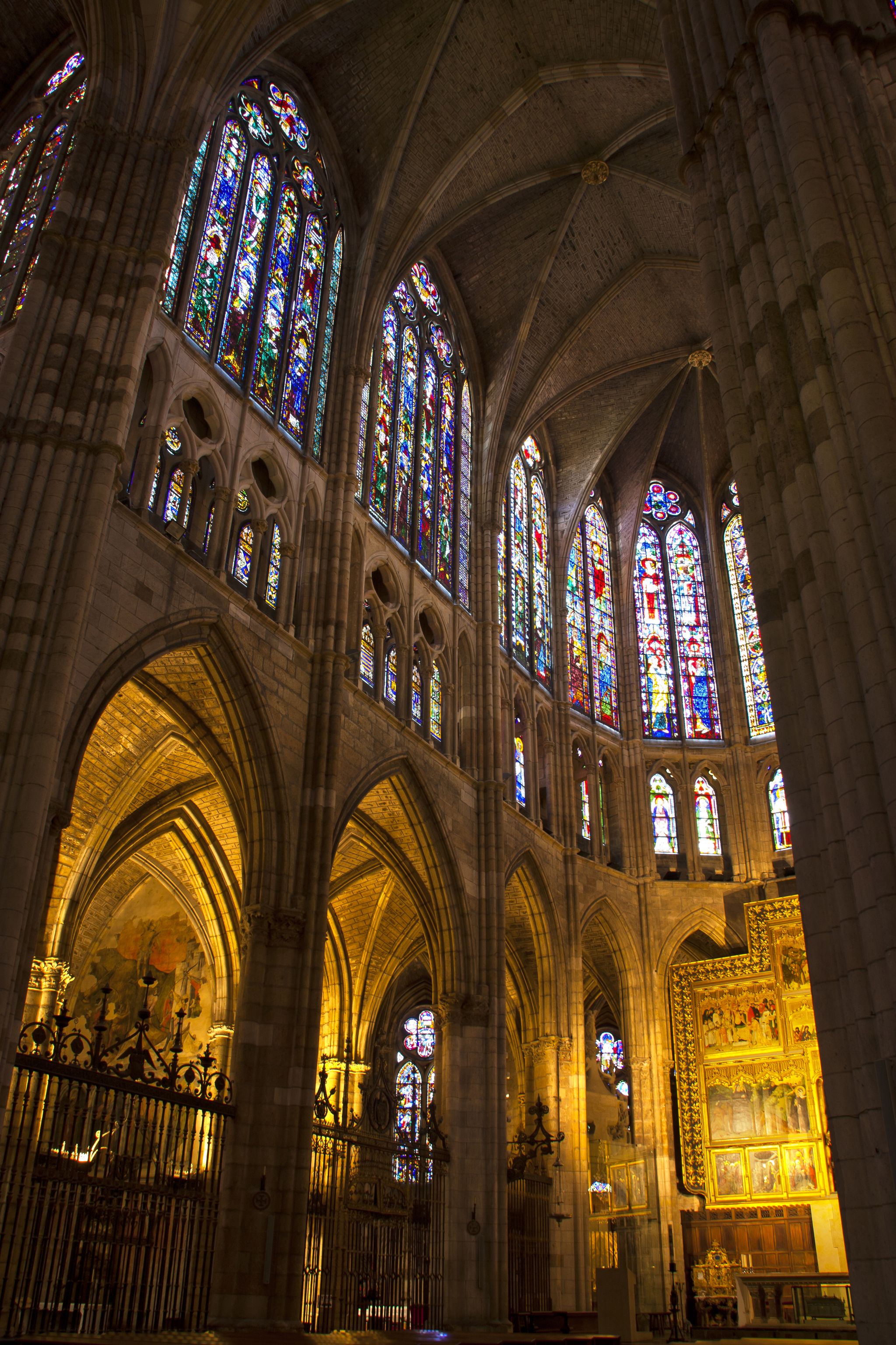 photo of high altar and stained glass windows in the cathedral of Leon, Spain.