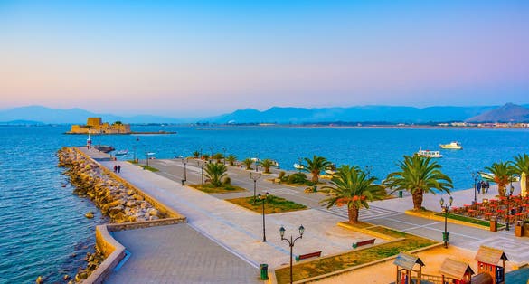 Photo of view of the port of Nafplio city in Greece at beautiful sunset.