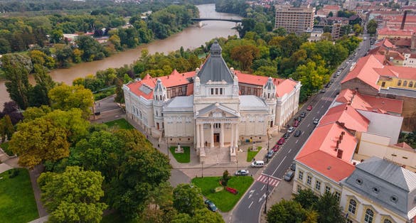 photo of view of Aerial photography of the Palace of Culture from Arad, Romania. Photography was shot from a drone at a higher altitude with camera tilted downwards.