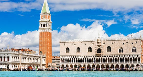 photo of Venice landmark, view from sea of Piazza San Marco or st Mark square, Campanile and Ducale or Doge Palace. Italy.
