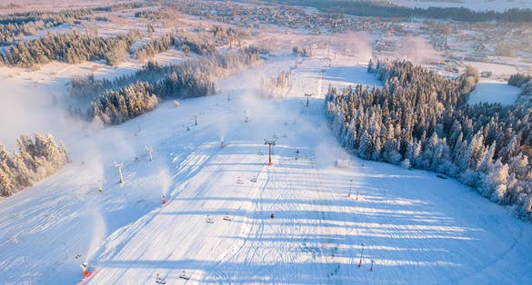 photo of drone view at ski slope in kotelnica, Zakopane, Poland at cold sunny winter day.