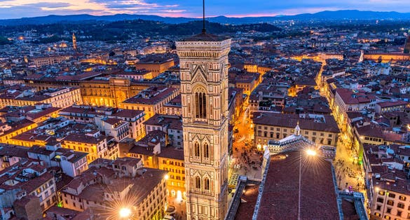 Photo of Giotto's Campanile - An aerial dusk view of Giotto's Campanile and the historical Old Town of Florence, as seen from the top of Brunelleschi's Dome of the Florence Cathedral. Florence, Tuscany, Italy.