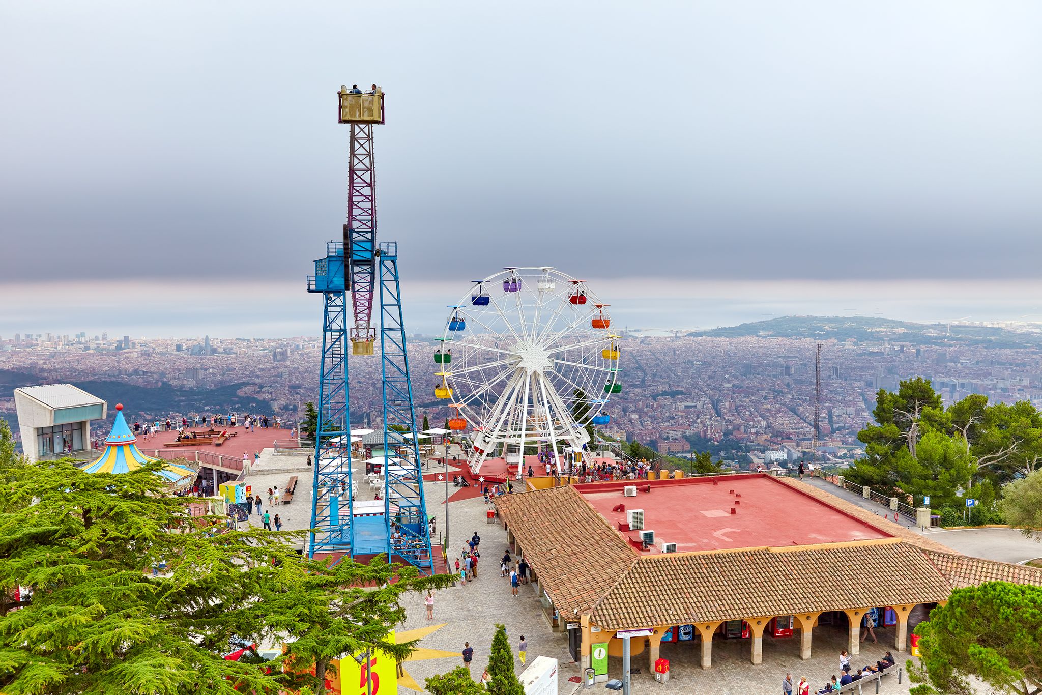 Photo of Barcelona city from mountain top Tibidabo. Catalonia, Spain.