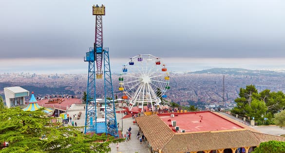 Photo of Barcelona city from mountain top Tibidabo. Catalonia, Spain.