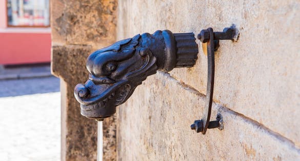 Photo of water tap of gothic stone fountain in Kutna Hora, a town in the Central Bohemian Region of the Czech Republic.