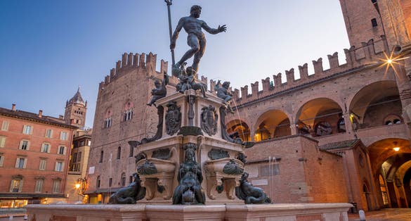 Photo of Fontana di Nettuno or Neptune fountain on Piazza Maggiore square at the morning dusk designed by Tommaso Laureti (1565).