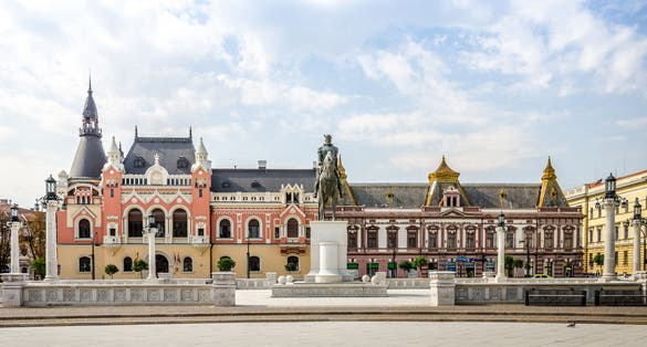 Oradea, Romania: Mihai Viteazu (Michael the Brave) Statue in the Unirii Square with the Greek-Catholic Episcopal Palace.
