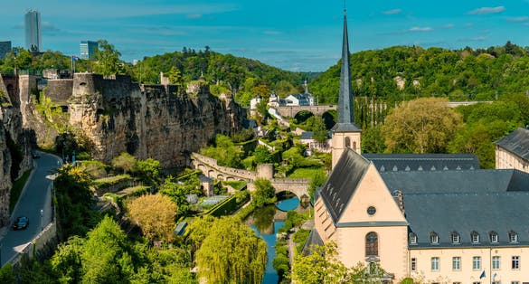 Photo of aerial panorama view of Luxembourg-City lower town with park and Neumünster abbey.