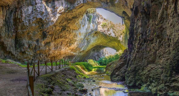 Photo of panoramic view inside the Devetashka Cave near Devetaki village and Osam river in Bulgaria.