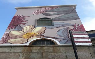Porto, Portugal old town ribeira aerial promenade view with colorful houses, Douro river and boats.