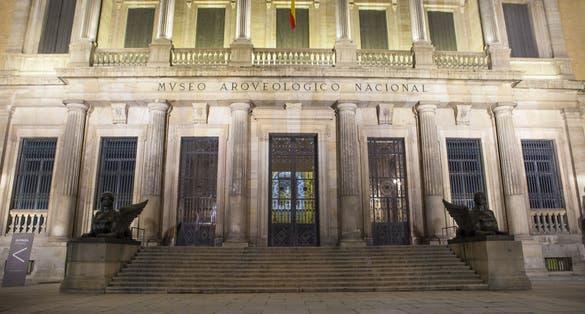 photo of facade building at night of National Archaeological Museum in Madrid, Spain.