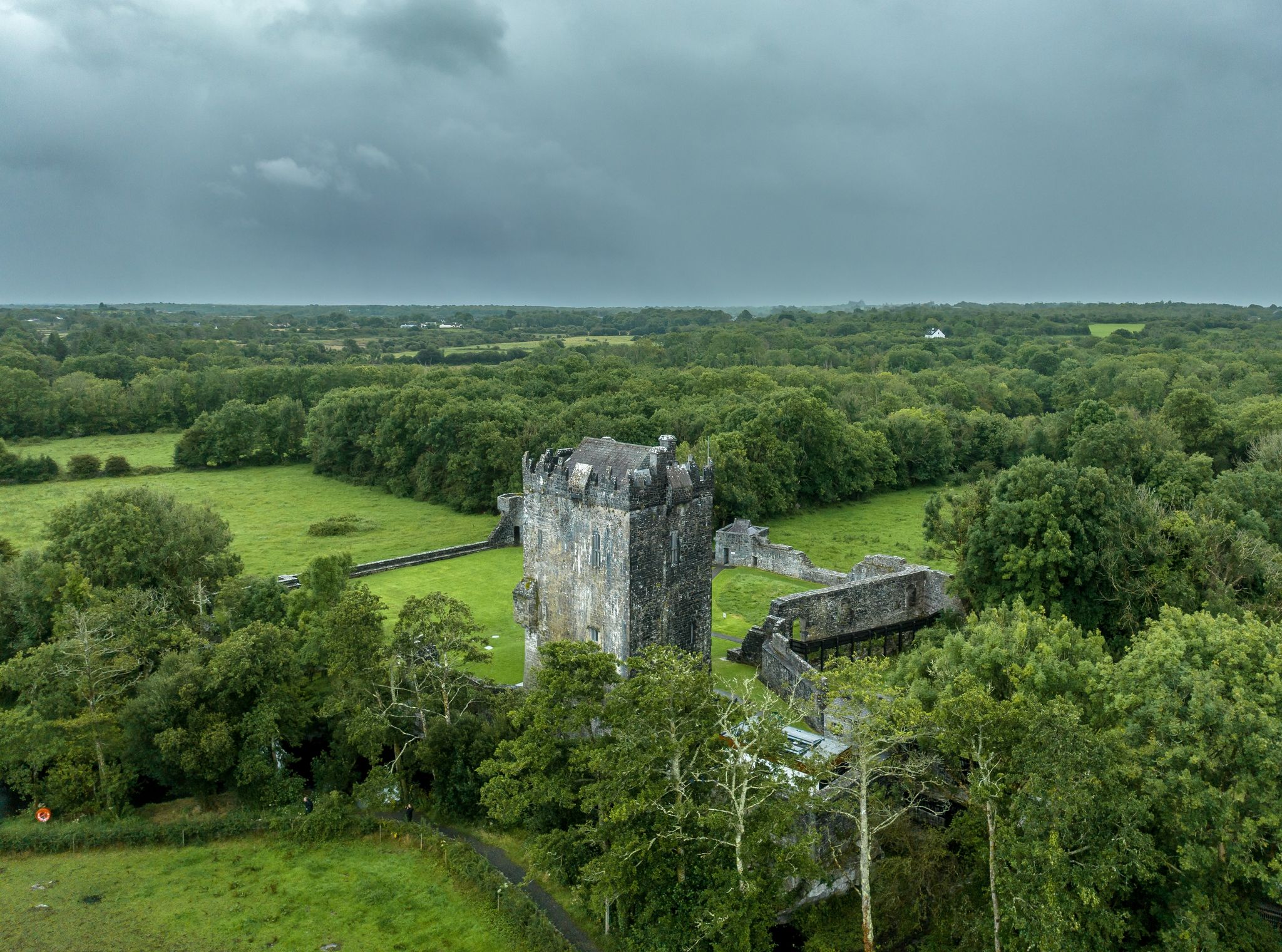 photo of view of Aerial view of Aughnanure castle in Ireland with large multi-storeytower house keep, Irland.