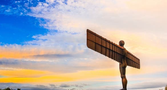 Photo of angel of the north a steel sculpture stand alone on morning day at Newcastle Upon Tyne, UK.