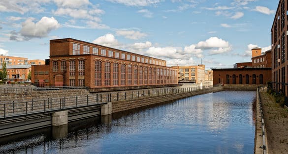 Photo of Vapriikki on the left is a museum centre in Tampere which hosts many exhibitions, Tampere, Finland.