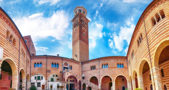 photo of Gorgeous View Torre dei Lamberti clock tower and Medieval stairs of Palazzo della Ragione palace building in Verona. Location: Verona, Veneto region, Italy.