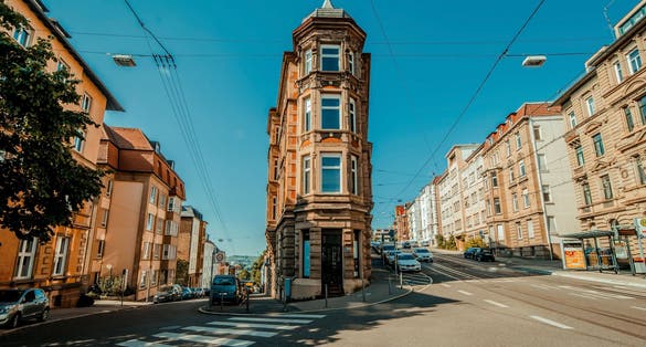 Photo of Stuttgart, Germany, Flat building in center of street inside stuttgart city at Eugensplatz square
