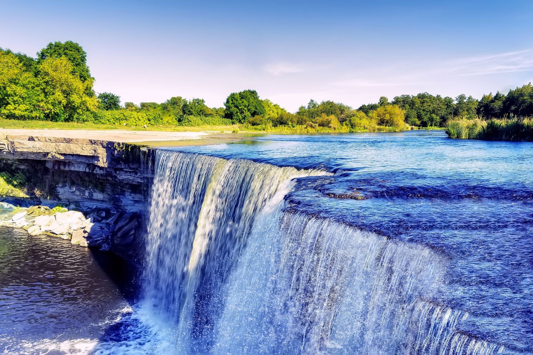 Photo of crystal clear blue waters of Jagala waterfall, Estonia.