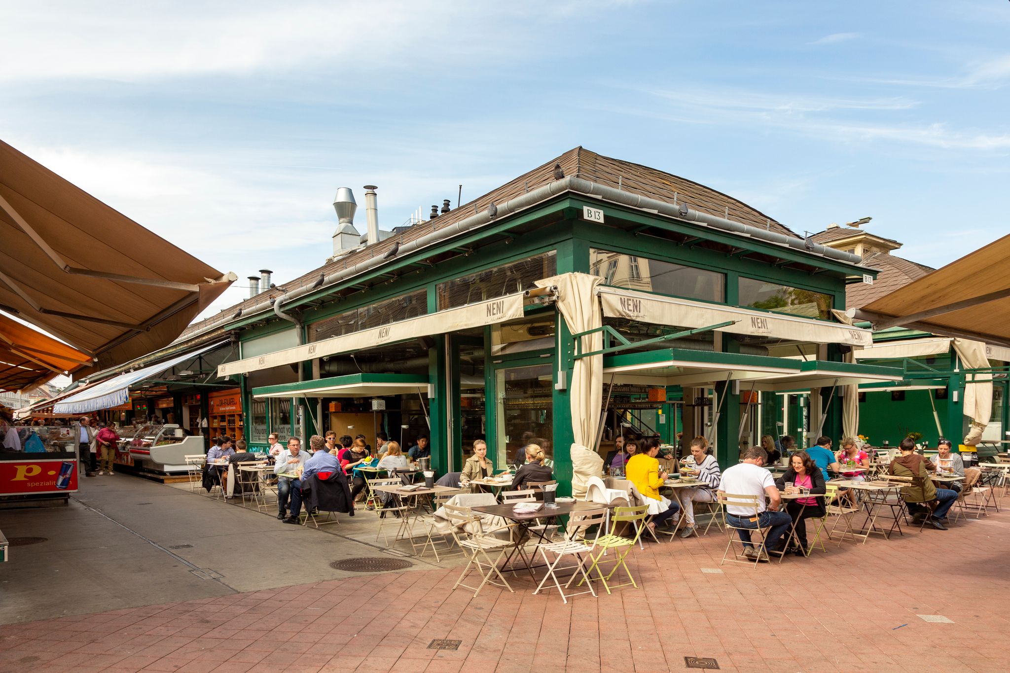 Photo of people enjoy the Naschmarket in Vienna. Since the 16th century people has come to the Naschmarkt get to enjoy the many different products from local producer, Austria.