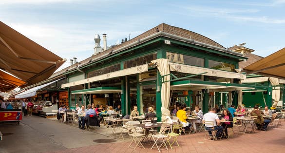 Photo of people enjoy the Naschmarket in Vienna. Since the 16th century people has come to the Naschmarkt get to enjoy the many different products from local producer, Austria.