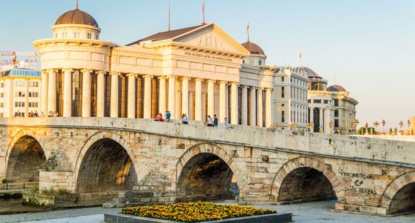 Photo of Archaeological Museum of Macedonia and famous Stone Bridge in downtown of Skopje.