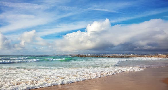 Photo of beautiful beach in Costa Caparica, Almada, Portugal.